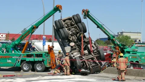 Two towing stabilizing truck after massive crash Stock Footage 133269728