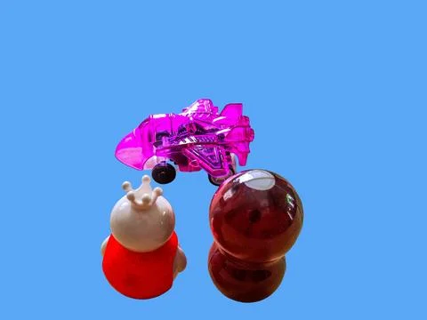 Two toy figures are looking at a toy jet Stock Photos