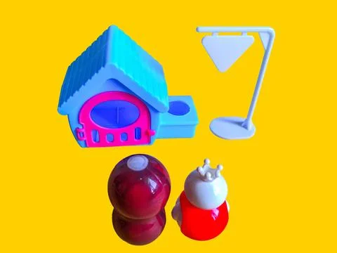 Two toy figures are looking at a toy house and a white toy sign Stock Photos