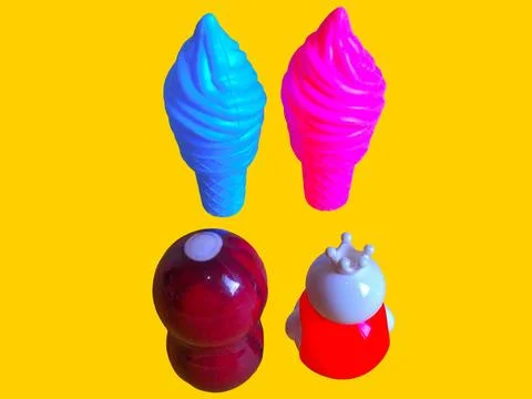 Two toy figures are looking at two toy ice creams Stock Photos