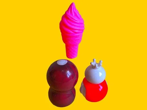 Two toy figures are looking at a toy ice cream Stock Photos