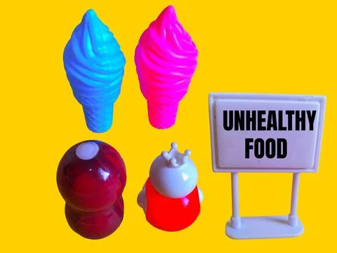 Two toy figures are looking at two ice creams and the word unhealthy food Stock Photos