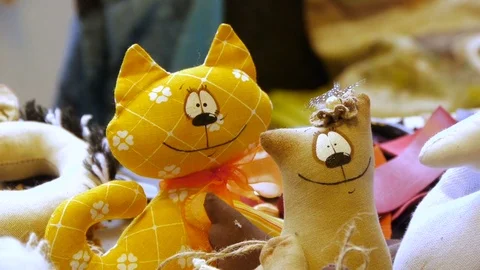 Two toy tilde cats stand and look straight, close-up Video stock 77107523