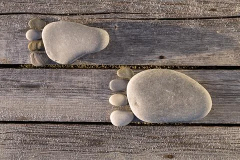 Two traces of pebbles over wooden planks Stock-Fotos