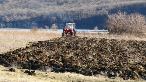 Two tractor plowing field Stock Footage 236718267
