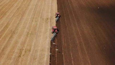 Two tractors plow the field Video stock 130098868