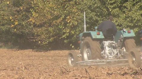 Two tractors preparing the ground for sowing Stock Footage 36992405