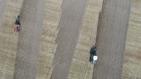 Two tractors in progress from above Stock Footage