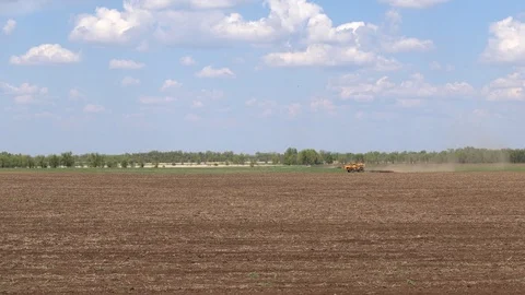 Two tractors two plow the field. Volgograd region, Russia. 4K Video stock 123133593
