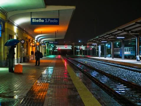 Two train driver in the night station Stock Photos