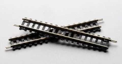 Two train rails on white background Stock Photos