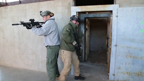 Two Trainees Learn to Clear a Building Stock Footage 70562021