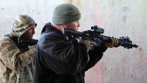Two Trainees Taught How To Approach a Doorway in Clearing a Building Stock Footage 70561696