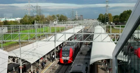 Two trains arrive at the platform from different sides Stock Footage 67470564