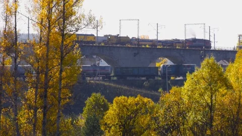 Two trains go in different directions. Viaduct. Railway bridge. Stock Footage 141147600