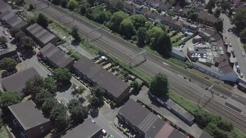 Two trains pass each other at different speeds drone shot Stock Footage 231892664