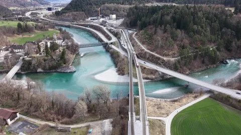 Two Trains Passing on Double Railway Bridge Over Rhine River Aerial 스톡 동영상 330749126