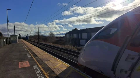 Two trains passing station Stock Footage 233830002