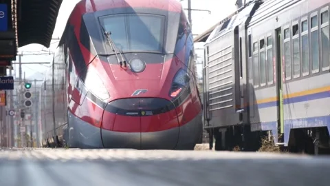 Two Trains at a Railway Station Passing in Opposite Directions Stock Footage 245430097