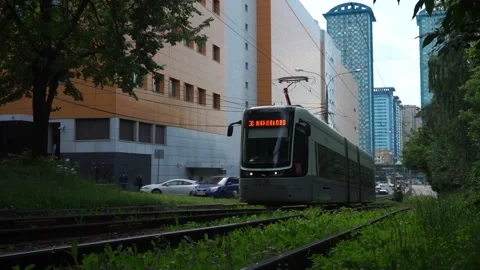 Two trams in the city in front of colored houses Stock Footage 133571303