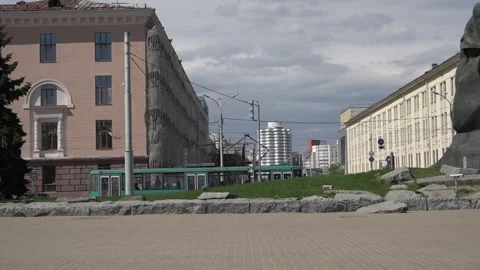 Two trams go towards each other between the buildings Stock-Footage 248441415