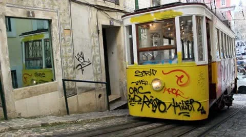 Two trams in lisbon graffiti Stock Footage 22196453