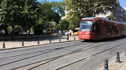 Two trams move towards each other on the street in Istanbul. Stock Footage 94265810