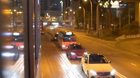 Two Trams Pass Each Other by at Nighttime Shallow DOP 4k Stock Footage 123141563