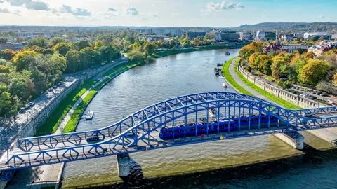 Two trams passing the bridge in Krakow, Poland. Aerial video Stock Footage 255402847