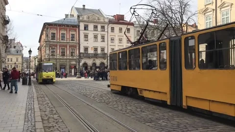 Two trams on the street of the old city Stock Footage 104480679