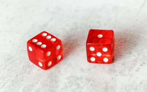Two translucent red craps dices on white board showing Natural or Seven Out Stock Illustration