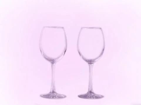 Two transparent empty glasses on a long leg Foto stock
