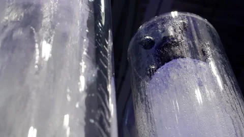 Two transparent flasks with a geyser. Stock Footage 163053244