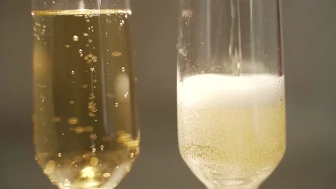 Two transparent glasses with champagne Stock Footage 147753234