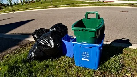 Two Trash Cans Along Roadside in Toronto, Canada Stock Photos