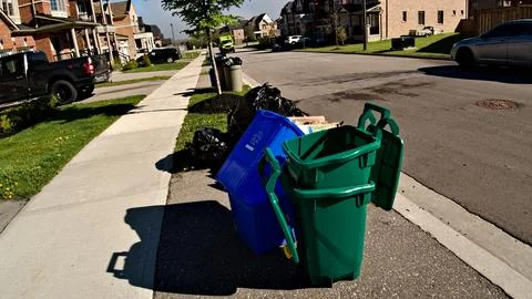 Two Trash Cans by the Roadside Stock Photos