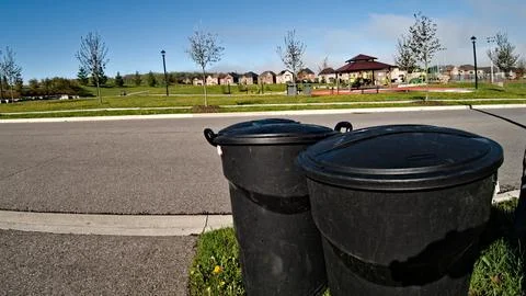 Two Trash Cans by Roadside in Toronto Stock Photos