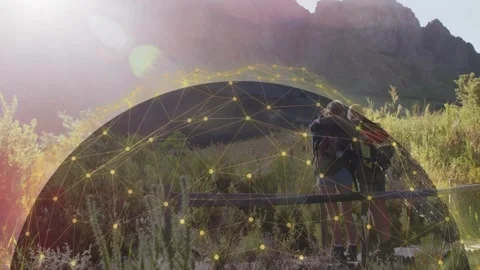Two travelers pausing at rail, adjusting pack and embracing while node overlay Video stock 333670499