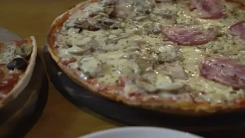 Two tray of Italian thin crust pizza variety of topping peperoni, mushroom, g Stock Footage 157533955