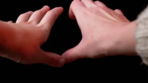 Two Trembling Hands Ask for Help on Black Background. Fear, Mercy. 4K. Close-up Video stock 147938118