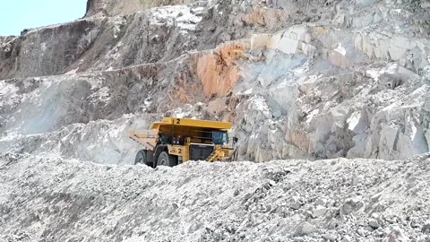 Two trucks are driving in a mine Stock Footage 168945624