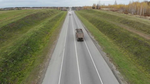 Two trucks moving towards each other on a busy highway.Freight container truck Stock Footage 99908522