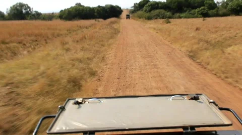 Two trucks pass each other on a dirt road(HD) k Stock Footage 801767