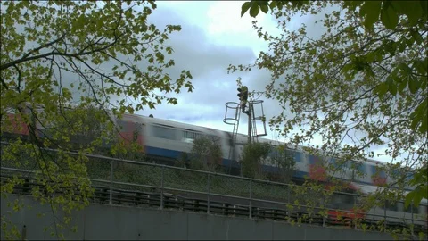 Two tube trains pass each other on a section of raised track. Stock Footage