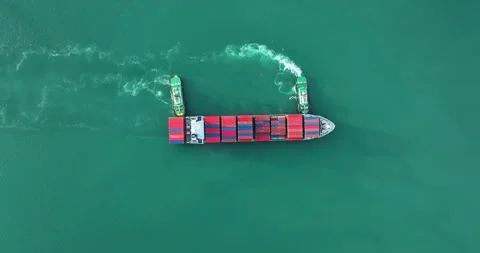 Two Tugboats Maneuvering Loaded Container Ship Across Deep Ocean Water Top .. Stock-Footage 340327850