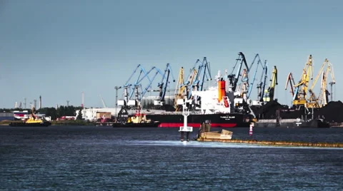Two tugboats from the port pulls a large ship Stock Footage 53856259