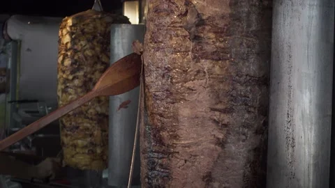Two Turkish chefs slicing the famous and most delicious street food doner keb Stock Footage 144486442