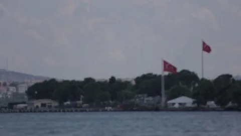 Two turkish flags flying over the Istanbul Harbor Basin Stock Footage 75212100