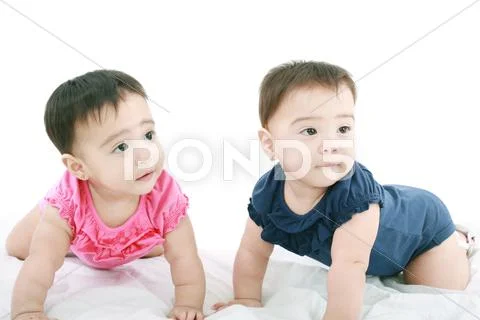 Two twin babies, girls Stock Photos