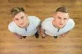 The two twin brother look to the camera. View from above Photo